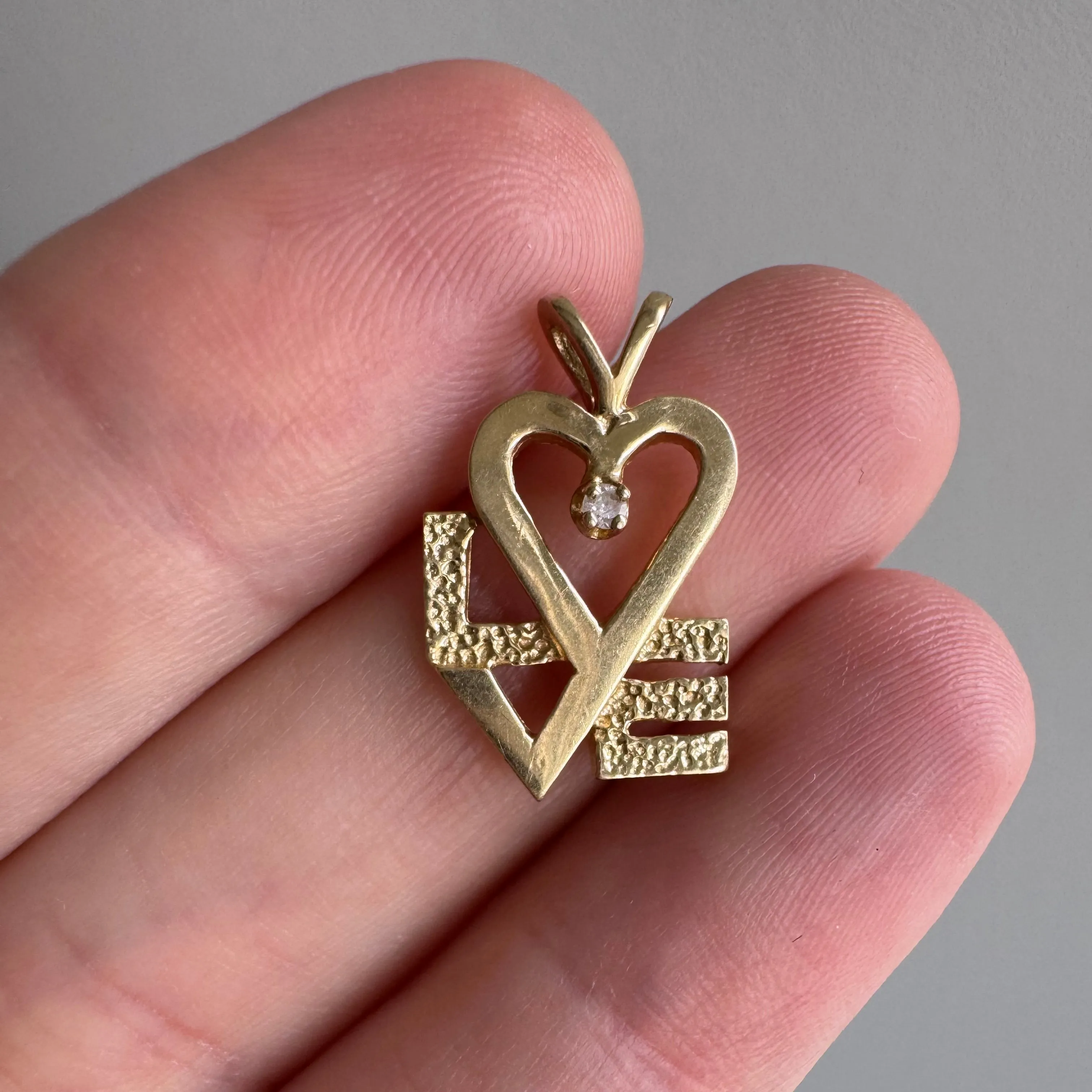 V I N T A G E // stylized LOVE / 14k yellow gold and diamond / a pendant